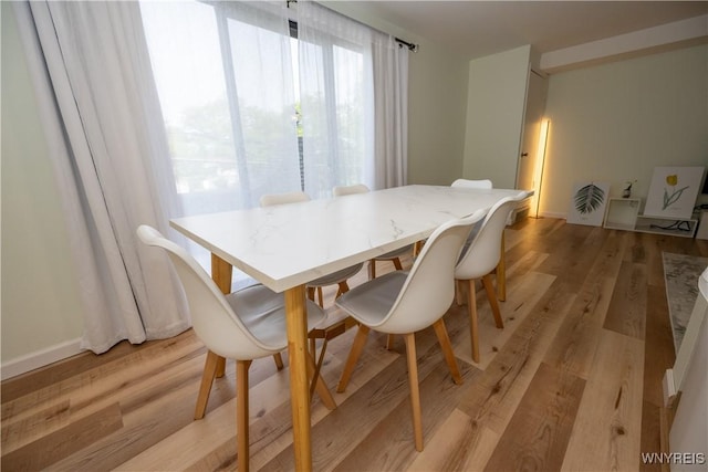132 Harrogate Unit E, Amherst, NY 14221 - dining area featuring light wood finished floors