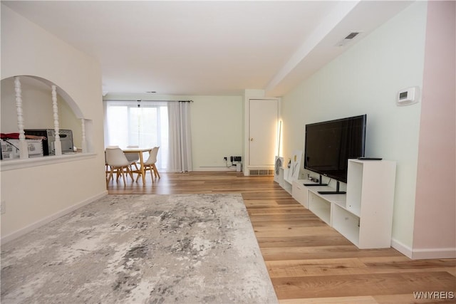 132 Harrogate Unit E, Amherst, NY 14221 - living room with light wood-type flooring and baseboards