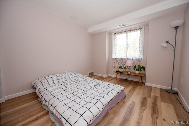 132 Harrogate Unit E, Amherst, NY 14221 - bedroom with light wood-type flooring and baseboards
