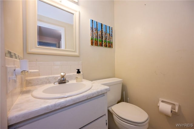 132 Harrogate Unit E, Amherst, NY 14221 - half bath with toilet, decorative backsplash, and vanity