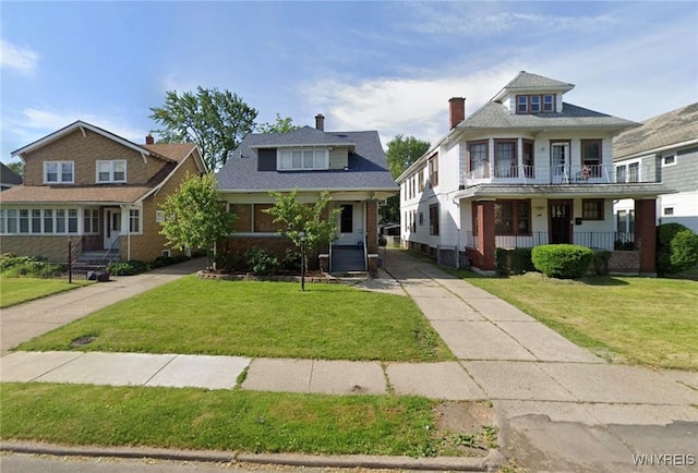 251 Minnesota Ave, Buffalo, NY 14215 - view of front of property with a porch, a front lawn, and driveway