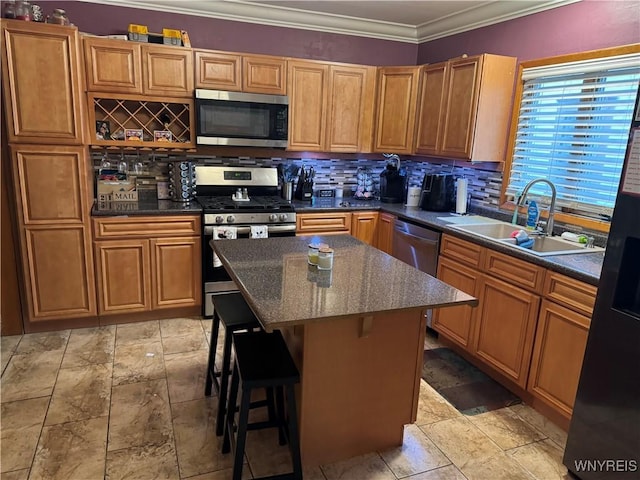 251 Minnesota Ave, Buffalo, NY 14215 - kitchen featuring appliances with stainless steel finishes, a sink, backsplash, a center island, and a breakfast bar area