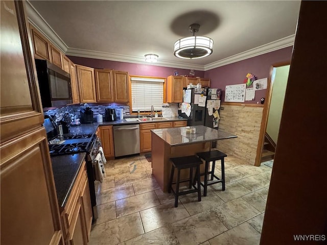 251 Minnesota Ave, Buffalo, NY 14215 - kitchen with appliances with stainless steel finishes, a sink, a kitchen bar, a kitchen island, and crown molding