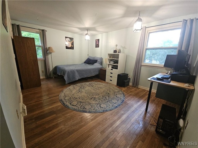 7066 E Ln, Boston, NY 14057 - bedroom featuring dark wood finished floors, multiple windows, and baseboards