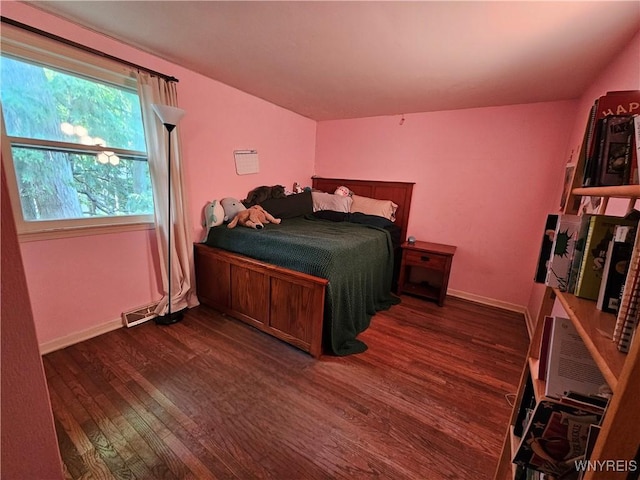 7066 E Ln, Boston, NY 14057 - bedroom featuring dark wood-type flooring and baseboards