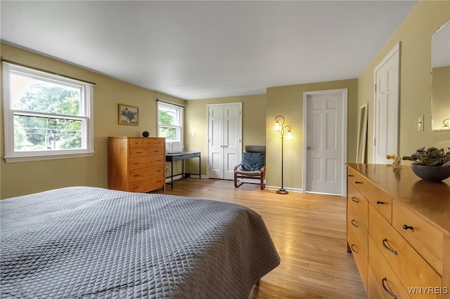 7066 E Ln, Boston, NY 14057 - bedroom featuring light wood-style flooring and baseboards