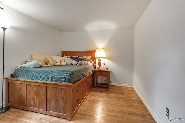 7066 E Ln, Boston, NY 14057 - bedroom with light wood-style floors and baseboards