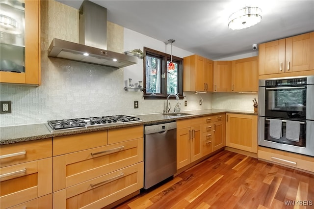 7066 E Ln, Boston, NY 14057 - kitchen with wall chimney exhaust hood, appliances with stainless steel finishes, wood finished floors, stone counters, and backsplash