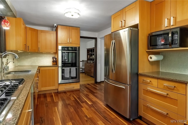 7066 E Ln, Boston, NY 14057 - kitchen featuring appliances with stainless steel finishes, dark wood-style flooring, decorative backsplash, and stone counters