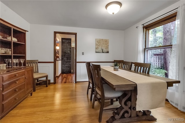 7066 E Ln, Boston, NY 14057 - dining space with light wood-type flooring and wainscoting