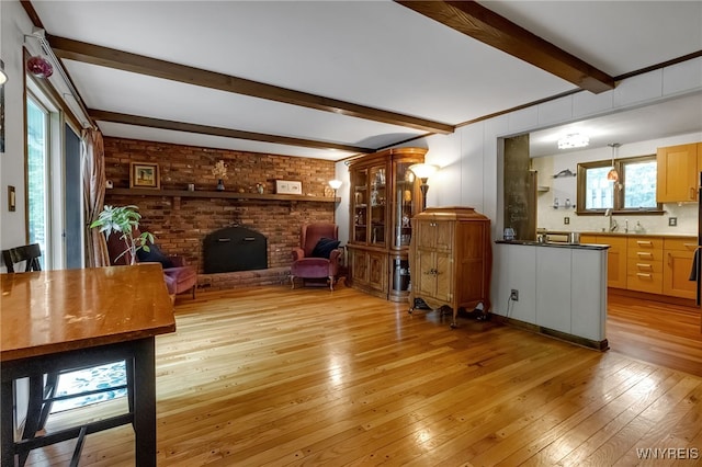 7066 E Ln, Boston, NY 14057 - living area with light wood-style floors and beam ceiling