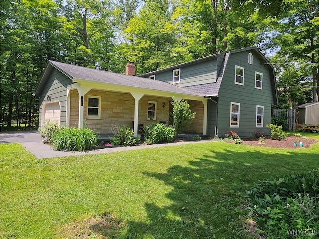 7066 E Ln, Boston, NY 14057 - view of front of house with a front lawn, a chimney, a gambrel roof, and roof with shingles