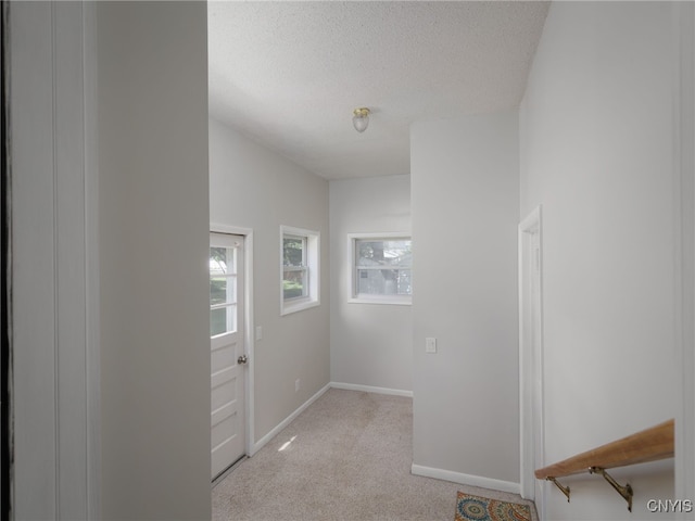 1120 Temple St, Watertown-City, NY 13601 - hall featuring light carpet and a textured ceiling