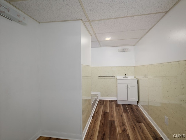1120 Temple St, Watertown-City, NY 13601 - bathroom featuring wood finished floors, vanity, and a wainscoted wall
