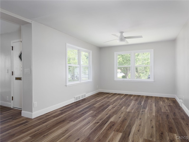 1120 Temple St, Watertown-City, NY 13601 - unfurnished room featuring plenty of natural light, dark wood-style flooring, and a ceiling fan