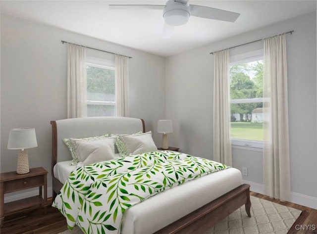 1120 Temple St, Watertown-City, NY 13601 - bedroom with multiple windows, wood finished floors, and ceiling fan