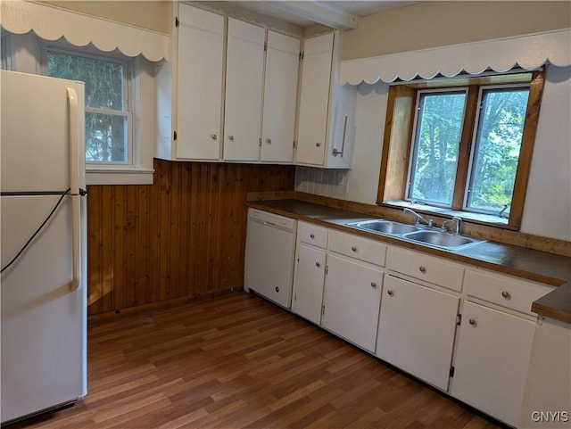 214 W 3rd St S, Fulton, NY 13069 - kitchen featuring white appliances, a sink, white cabinetry, plenty of natural light, and wood walls