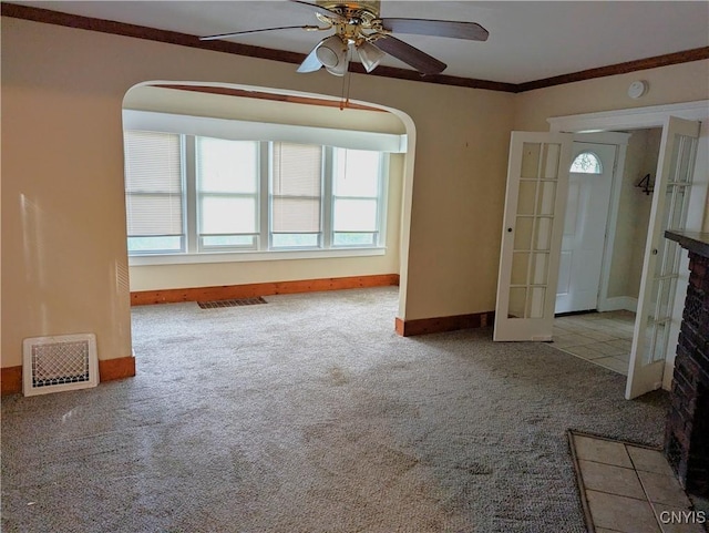 214 W 3rd St S, Fulton, NY 13069 - carpeted empty room featuring arched walkways, a ceiling fan, baseboards, ornamental molding, and a smoke detector