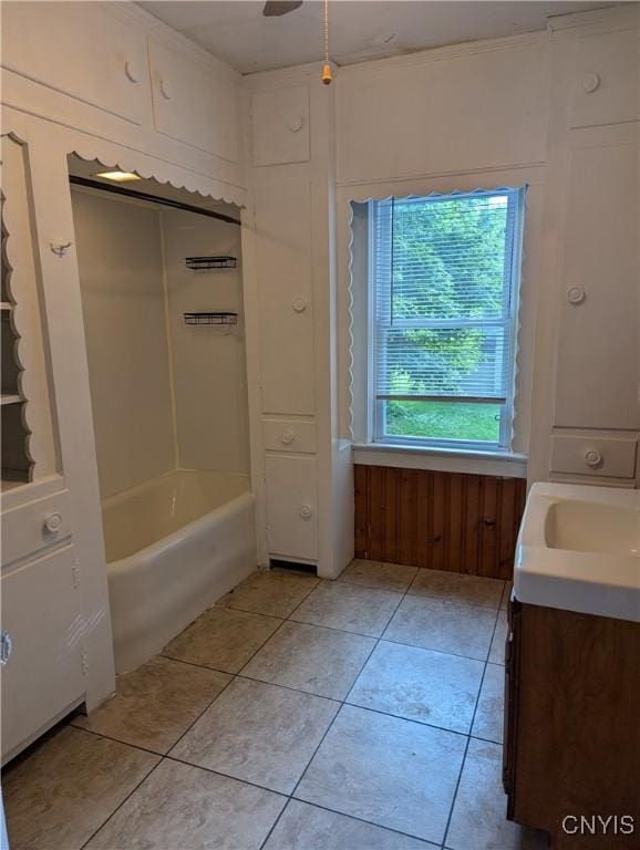 214 W 3rd St S, Fulton, NY 13069 - full bath with vanity, tile patterned floors, and washtub / shower combination