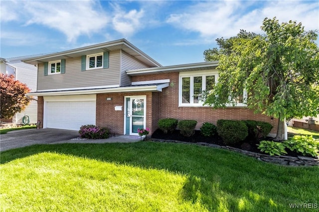 291 Everett Pl, Tonawanda-Town, NY 14150 - tri-level home with brick siding, an attached garage, concrete driveway, and a front yard