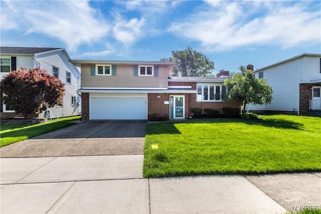 291 Everett Pl, Tonawanda-Town, NY 14150 - split level home featuring concrete driveway, an attached garage, a front lawn, and brick siding