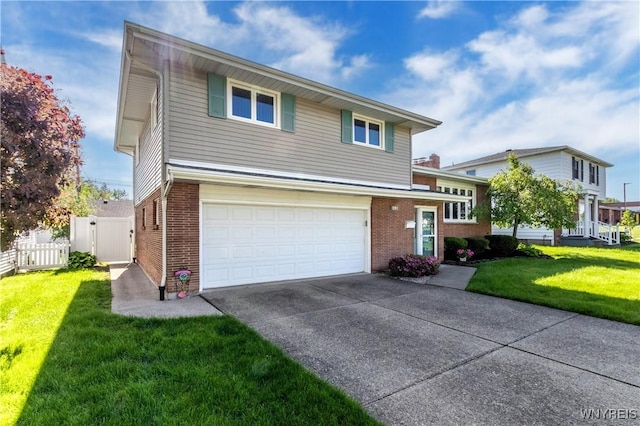291 Everett Pl, Tonawanda-Town, NY 14150 - view of front of house featuring a garage, brick siding, concrete driveway, and a gate