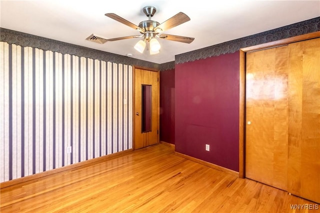 291 Everett Pl, Tonawanda-Town, NY 14150 - empty room with wood finished floors, baseboards, and ceiling fan