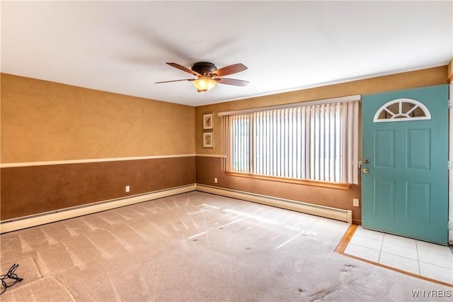 291 Everett Pl, Tonawanda-Town, NY 14150 - entrance foyer with ceiling fan, a baseboard heating unit, carpet flooring, and baseboards
