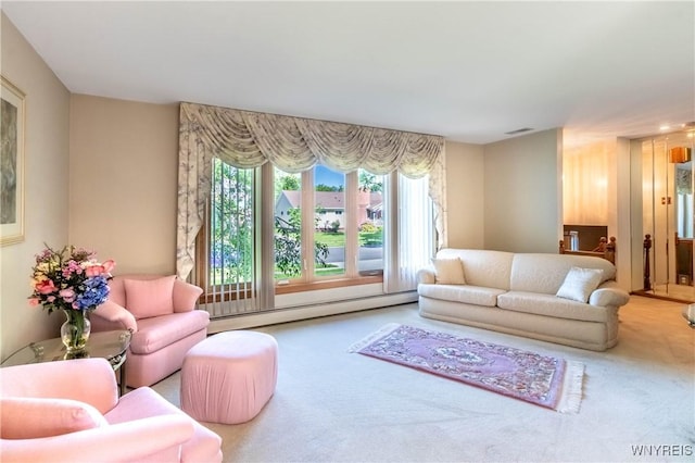 291 Everett Pl, Tonawanda-Town, NY 14150 - living area with a baseboard radiator and carpet floors