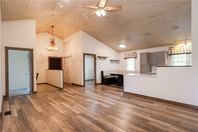 676 County Road 64, Big Flats, NY 14903 - unfurnished living room with wood ceiling, a chandelier, light wood-type flooring, ceiling fan, and high vaulted ceiling