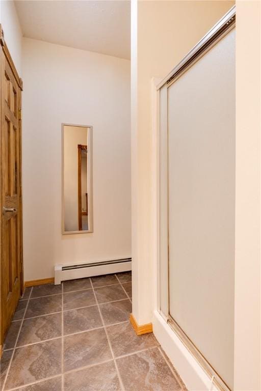 676 County Road 64, Big Flats, NY 14903 - bathroom featuring baseboard heating and a shower stall