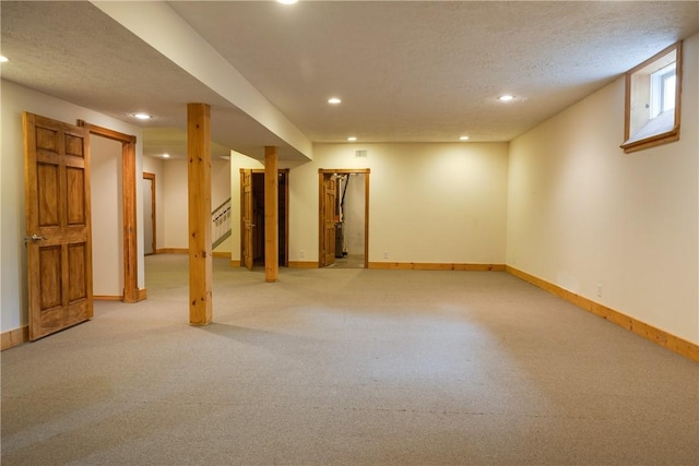 676 County Road 64, Big Flats, NY 14903 - finished below grade area with recessed lighting, light carpet, a textured ceiling, and stairs