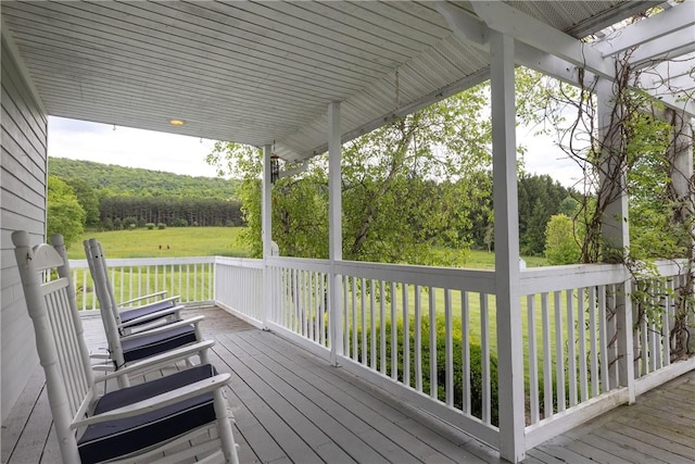 676 County Road 64, Big Flats, NY 14903 - wooden deck with a yard and a view of trees