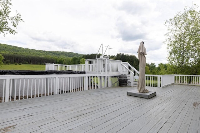 676 County Road 64, Big Flats, NY 14903 - wooden terrace with a wooded view