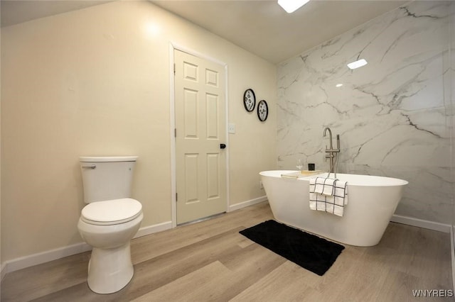 70 Minard St, Lockport-City, NY 14094 - full bathroom with wood finished floors, a soaking tub, and toilet