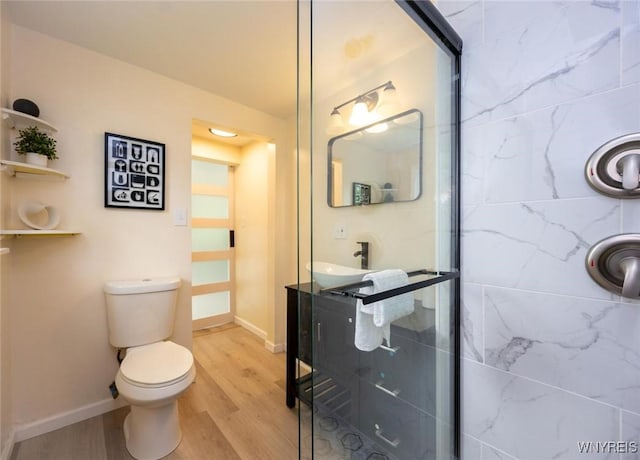70 Minard St, Lockport-City, NY 14094 - full bathroom featuring wood finished floors, a shower with door, and toilet