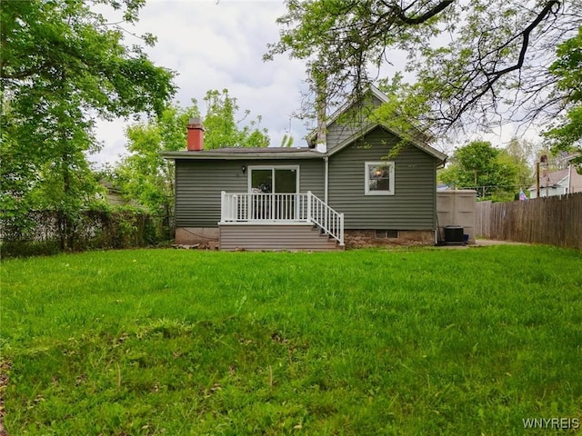 70 Minard St, Lockport-City, NY 14094 - rear view of property featuring central AC and a chimney