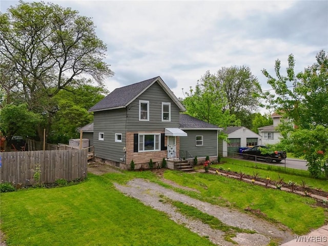 70 Minard St, Lockport-City, NY 14094 - view of front of house featuring a shingled roof