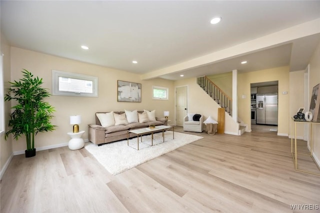 70 Minard St, Lockport-City, NY 14094 - living area featuring stairs, light wood-type flooring, baseboards, and recessed lighting