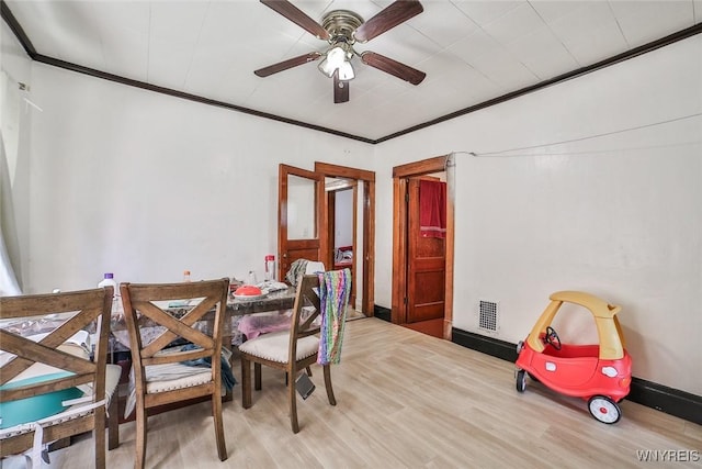110 Saint Louis Ave, Buffalo, NY 14211 - dining area with ceiling fan, wood finished floors, crown molding, and baseboards