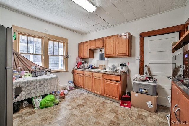 110 Saint Louis Ave, Buffalo, NY 14211 - kitchen featuring brown cabinetry and a sink