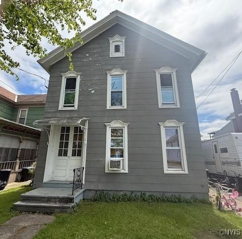 322 Eastern Ave, Herkimer, NY 13350 - back of house featuring a lawn