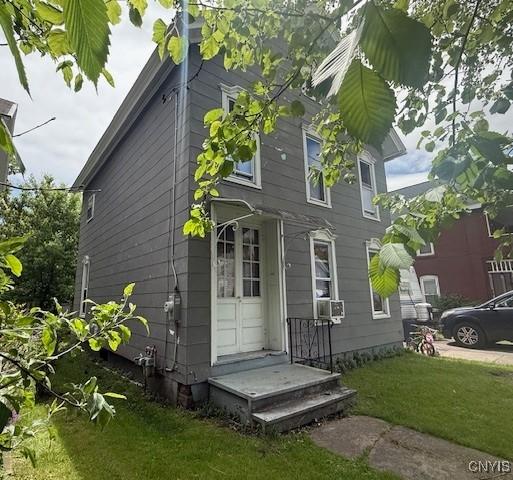 322 Eastern Ave, Herkimer, NY 13350 - view of property exterior featuring a yard and cooling unit