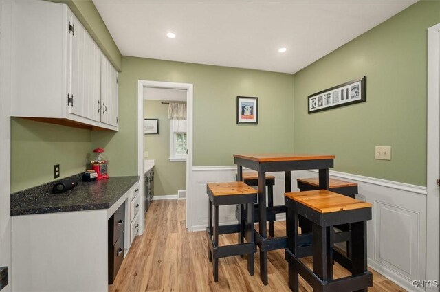 408 Elm St, Manlius, NY 13066 - dining area featuring light wood-style floors, recessed lighting, and a wainscoted wall