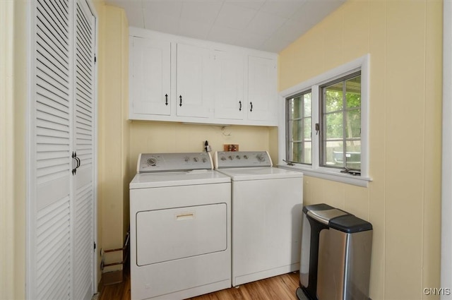 408 Elm St, Manlius, NY 13066 - washroom with cabinet space, washer and dryer, and light wood-style floors
