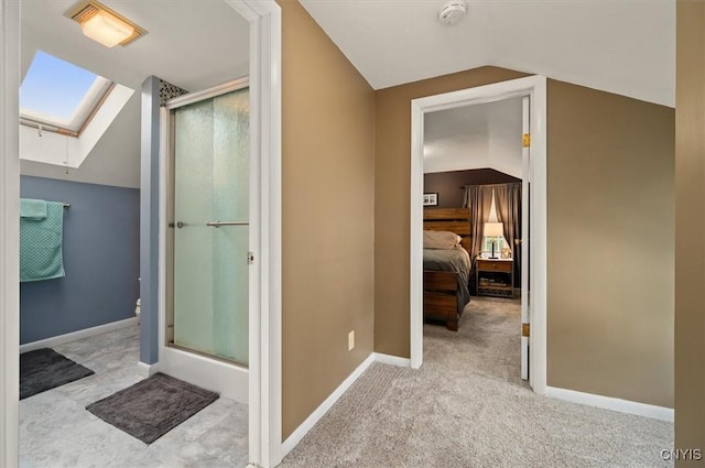 408 Elm St, Manlius, NY 13066 - bathroom featuring lofted ceiling, a shower stall, a skylight, toilet, and ensuite bath