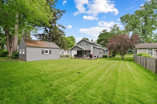408 Elm St, Manlius, NY 13066 - view of yard featuring a patio area and an outbuilding