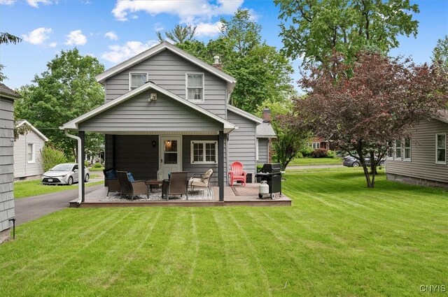 408 Elm St, Manlius, NY 13066 - rear view of house featuring a lawn