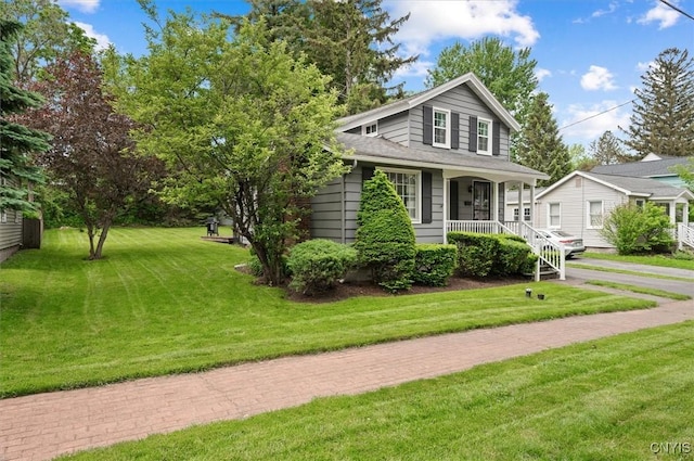 408 Elm St, Manlius, NY 13066 - view of front of home with covered porch and a front lawn