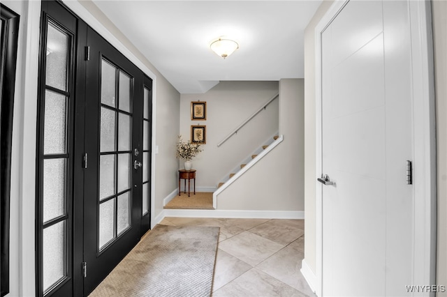 234 Misty Ln, Amherst, NY 14051 - foyer entrance featuring stairs, baseboards, and light tile patterned floors